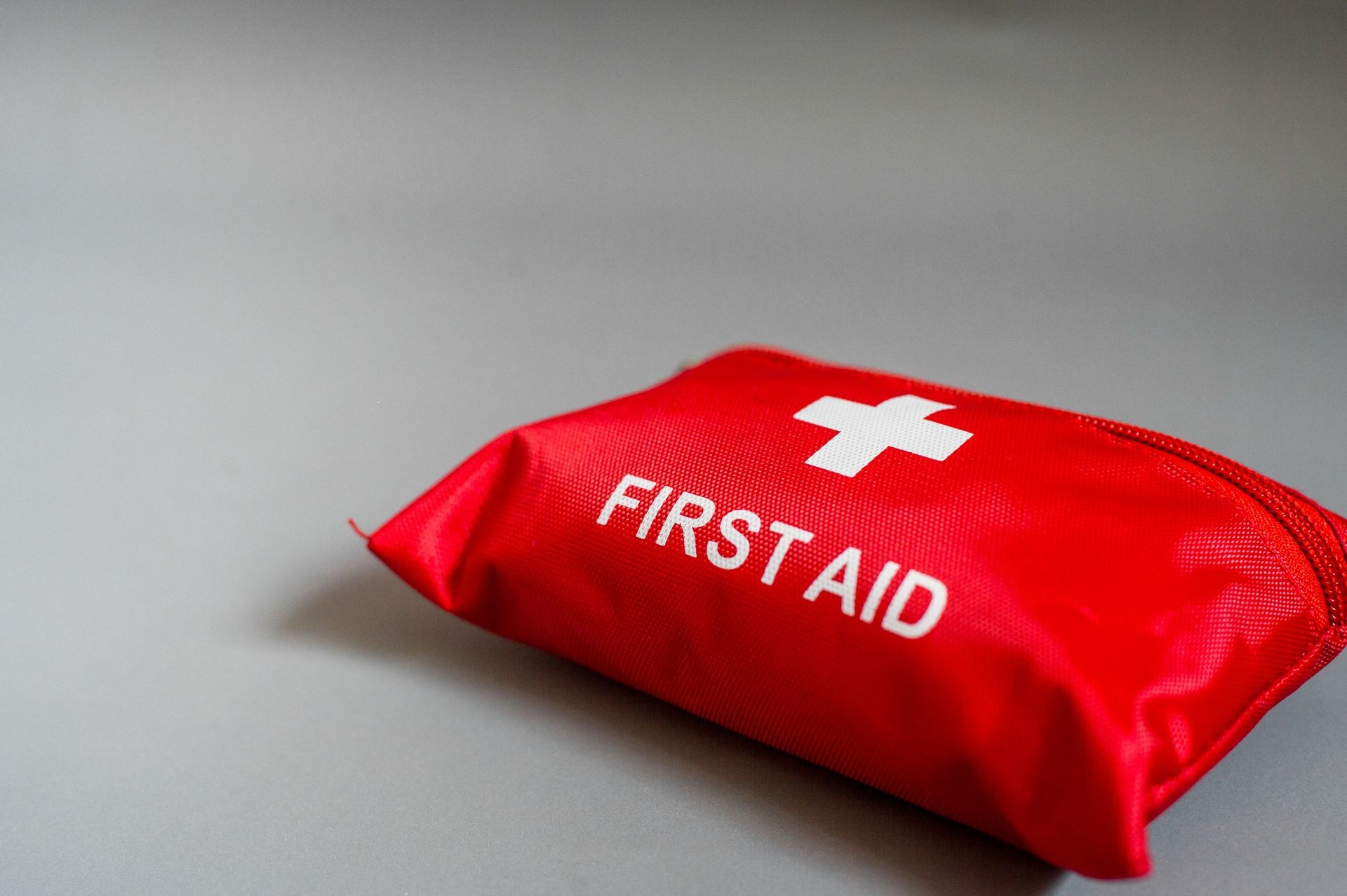 First aid kit on black gray background